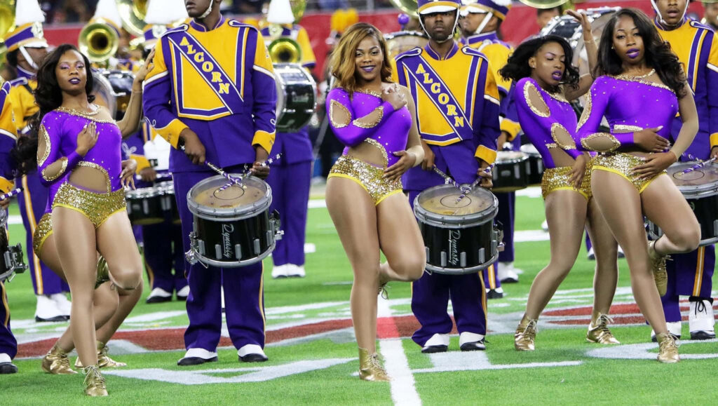 Dancers performing on the field alongside the Alcorn State University band
